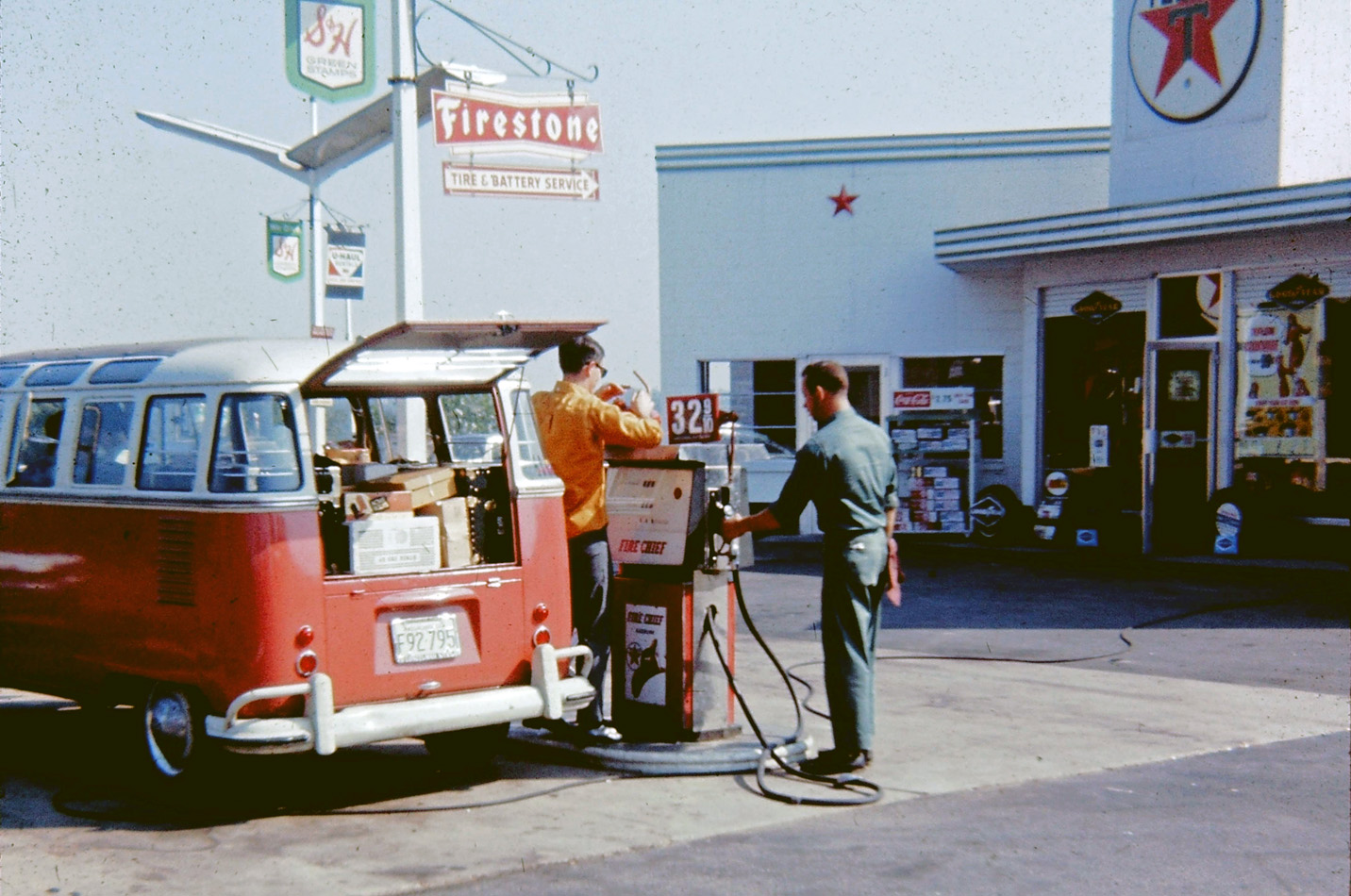 Filling up our 1959(?) VW 23 window sunroof bus in the gas station across the street from our parents' place in Agawam, Massachusetts in September 1967. My brother is standing next to the pump. A few minutes later we head off across the country. Today that particular bus, in that condition, would cost over $100K. Yikes. Scanned from a square format Ektachrome slide. View full size.