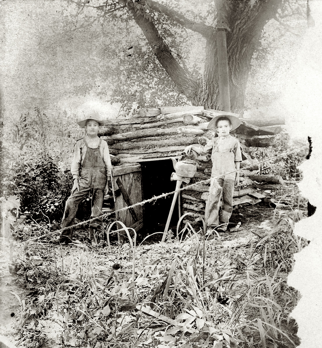 My grandfather and his brother outside the cabin they built near Louisville, Kansas in 1903.