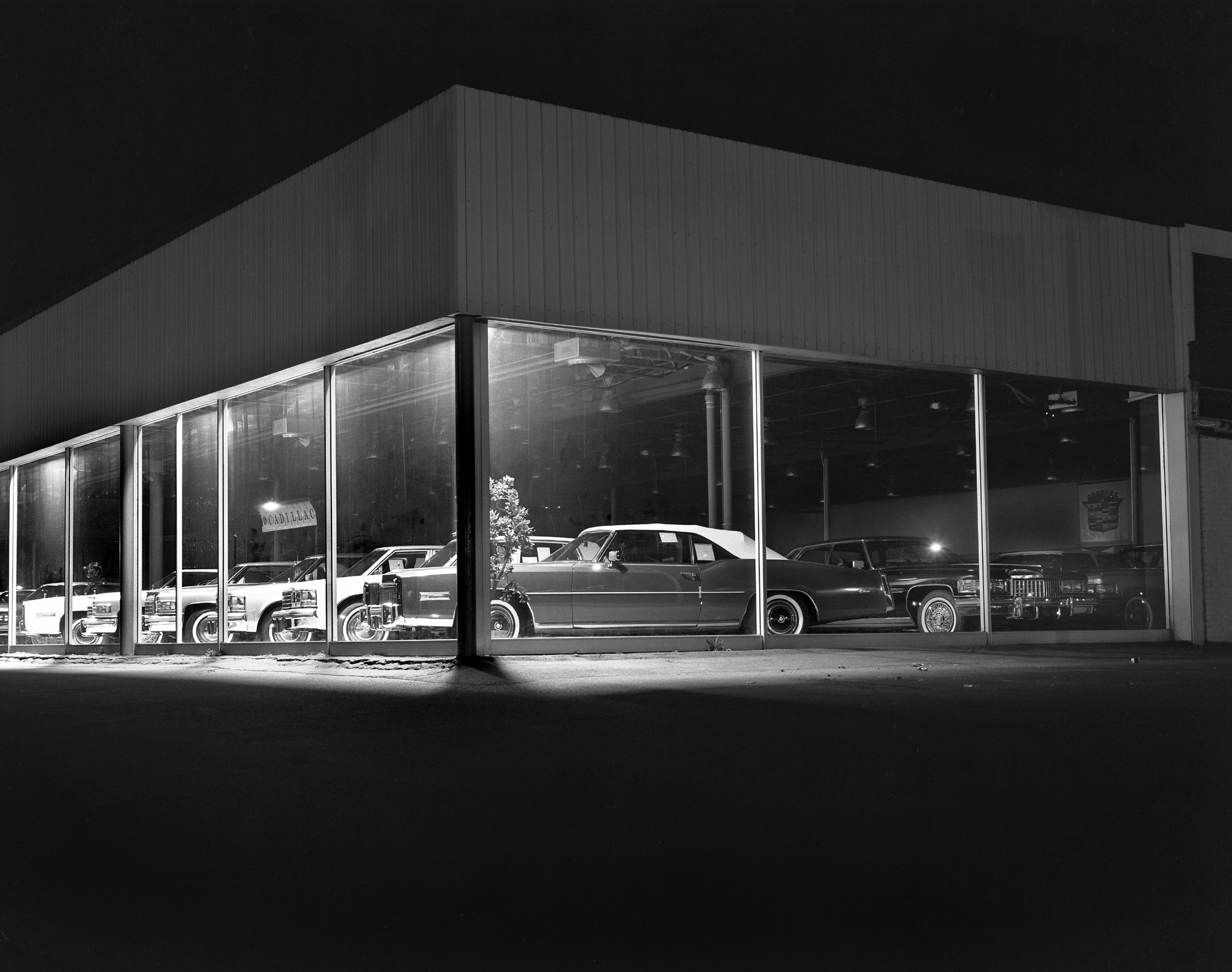 Patkin Cadillac, Mystic Valley Parkway in Medford, Mass., 1977. A dealership with many land yachts for sale. Long gone; the owner passed away a few months ago. The windows were always lit up, and the cars looked great. View full size.
