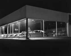 Patkin Cadillac, Mystic Valley Parkway in Medford, Mass., 1977. A dealership with many land yachts for sale. Long gone; the owner passed away a few months ago. The windows were always lit up, and the cars looked great. View full size.
(ShorpyBlog, Member Gallery)