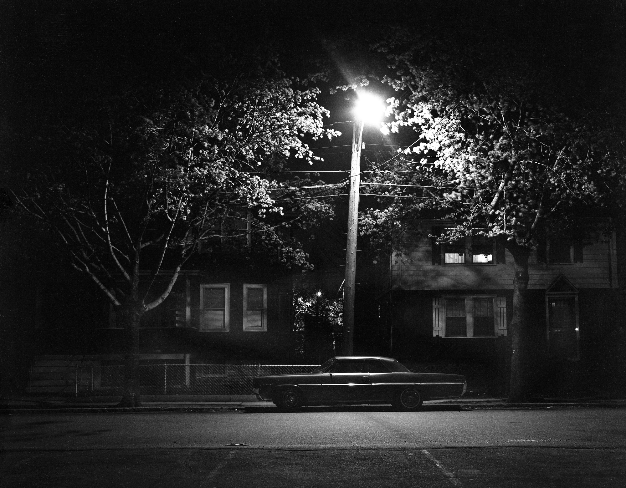 A very quiet night, after midnight in Medford, Massachusetts. Not sure of the make or year of the car. View full size.
