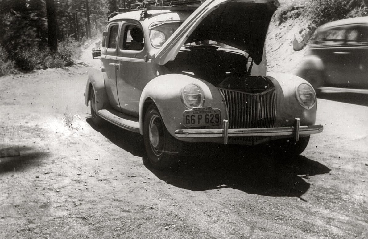 Oops, car trouble. I don't think it ruined the vacation much since there are so many other pictures of the Yosemite vacation. Doing a little bit of research, it's a Mercury, likely a 1939. CORRECTION: It is a Ford, was correct originally. View full size.