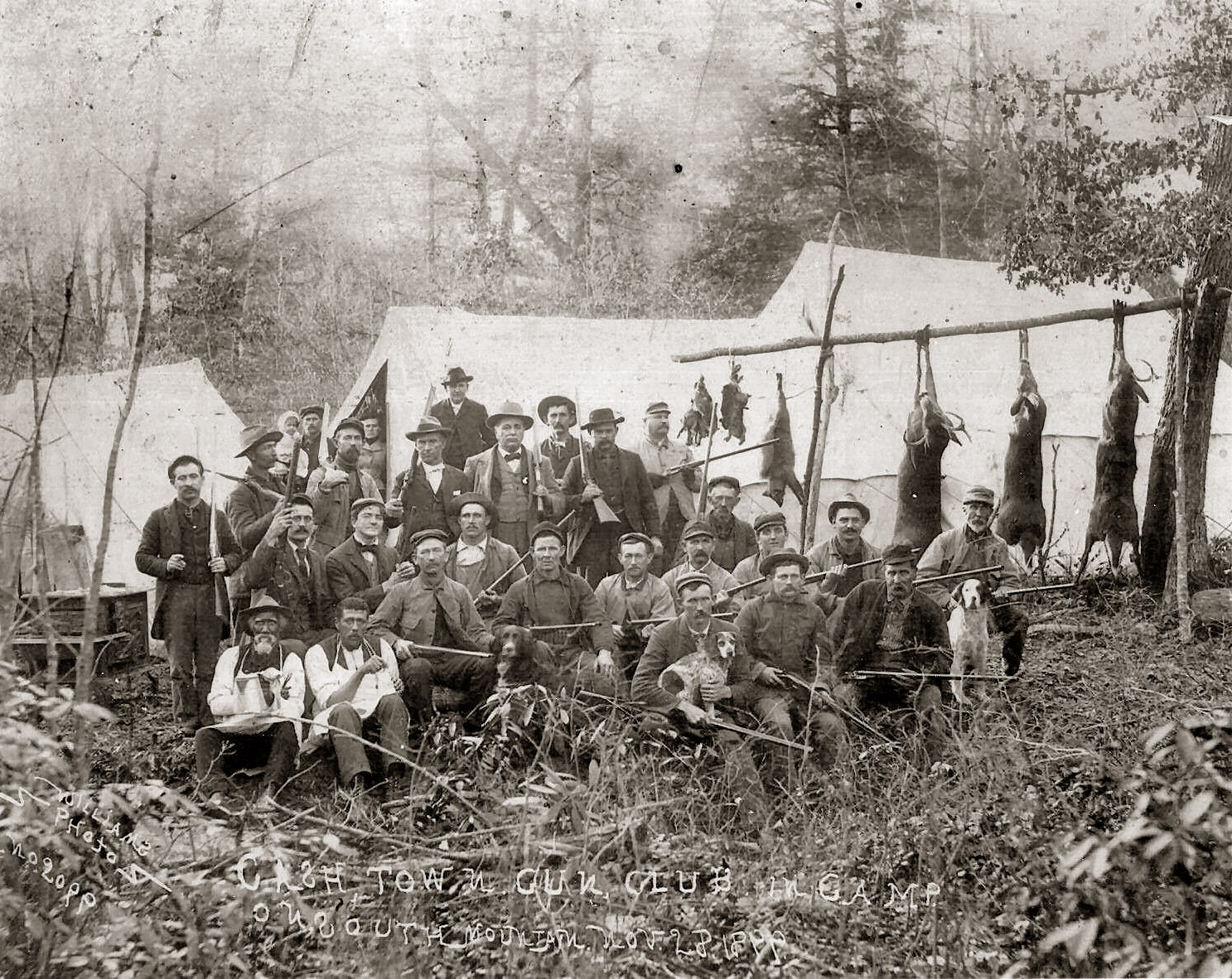 Cashtown Gun Club, Adams County, Pa., 1899. If you look closely at the old gent in the lower left, he's obviously the camp cook. He's holding a pot with a towel which is probably hot coffee. The man to his left must be his helper and he's holding something that appears to be a flask. A good time was had by all. 

The caption at the bottom reads: "Cashtown Gun Club in Camp on South Mountain Nov. 28, 1899" South Mountain is actually in Maryland, but not far away.

Cashtown is near Gettysburg and both Union and Confederate troop road through town and stayed at the Inn there which is still open to the public. I've tried to identify the men in the photograph but have had no success. Input welcome.