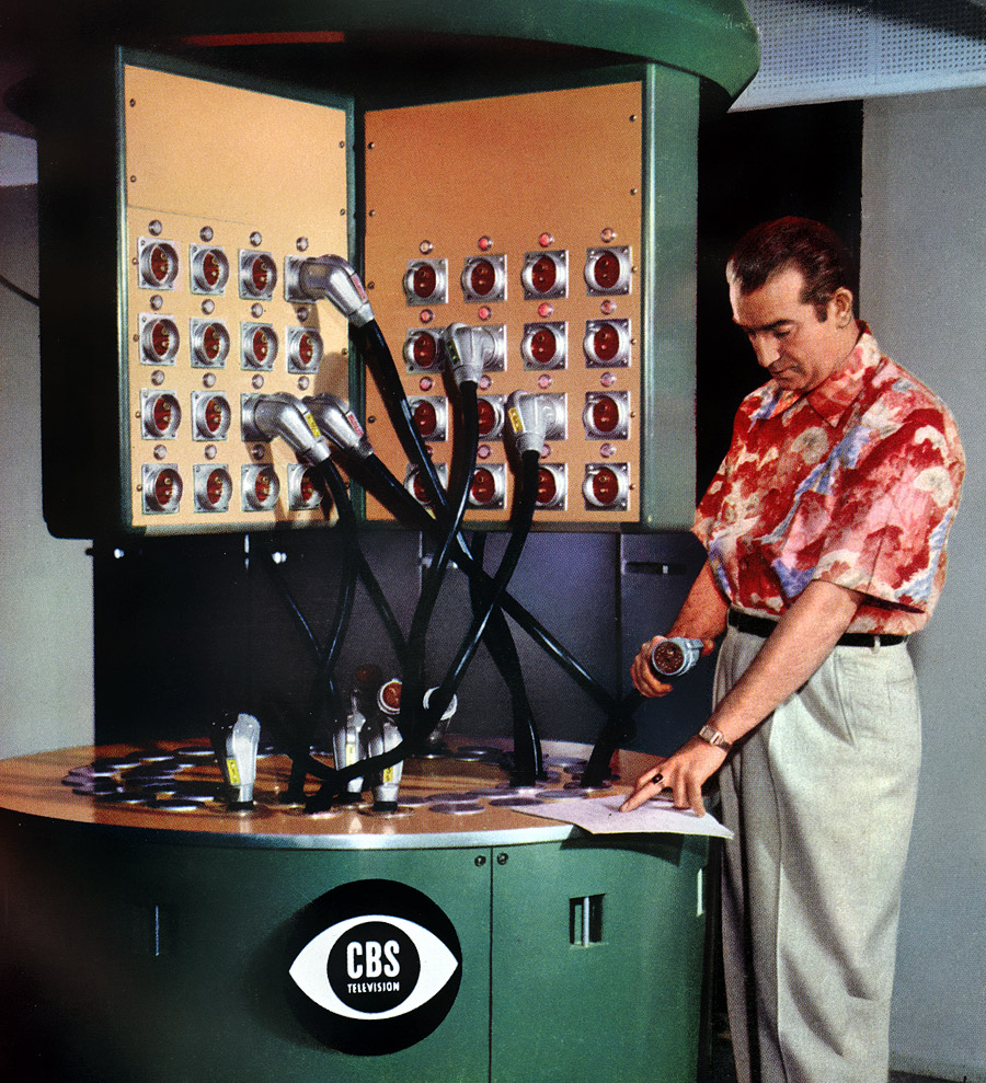 August 1954. Eight-panel patching bay at CBS Television City in Los Angeles, for assignment of any of eight telecine film chains (slide or movie projector and TV camera) to any of several control rooms, for insertion of film content into video feed. One television camera is used with each of three Eastman 16 mm projectors, three RCA 35 mm projectors and two Gray "Telop" projectors. Multipin cable plugs contain two audio and video outputs, start-stop circuits and intercom and monitoring circuits. View full size. Ektachrome by Peter Samerjan.