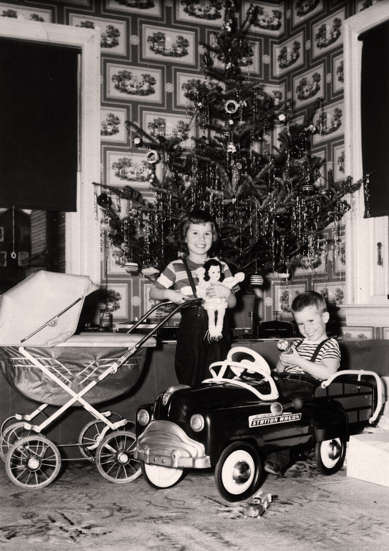My sister and brother at the house in Merchantville, NJ, during Christmas in 1951. My brother still owns the Lionel trains seen under the tree. Looks like it was a good year for the kids. View full size.