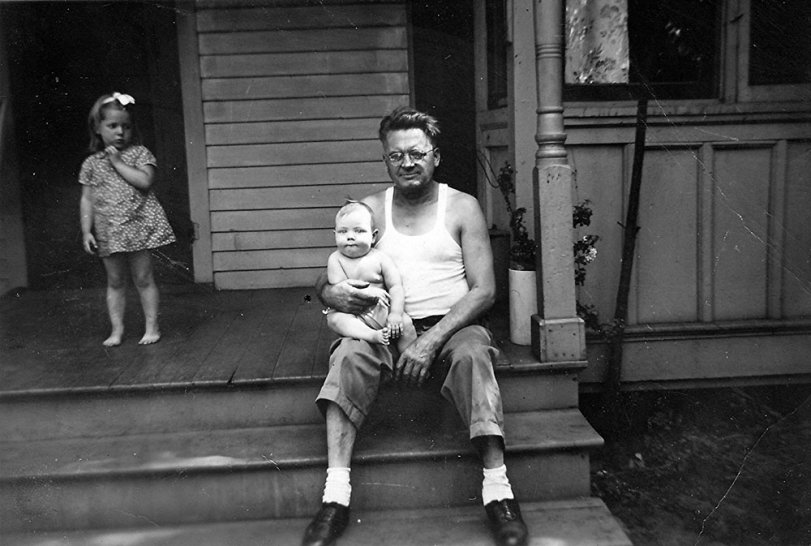 William Cleveland Woods, 1941, holds my cousin Johnny as my sister looks on. View full size.
