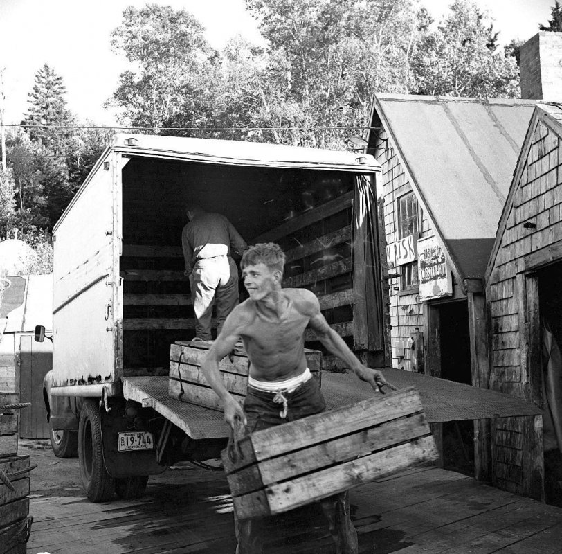 Men unloading lobster crates from truck, unknown location in Maine, possibly Boothbay Harbor. From my negatives collection. View full size.
