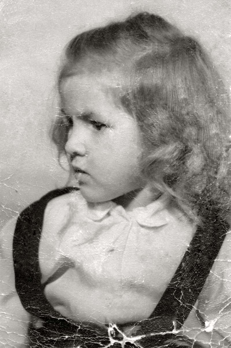 My mother, born in 1945, had a large cyst over her right eye, which could not be removed until she was five years old.  She was only four when this photo was taken, but she remembers someone saying she had turn the "ugly" away from the camera. She was extremely bashful and this really hurt her feelings. I think she was a beautiful little girl (of course) and I cannot imagine a photographer saying such a thing today.