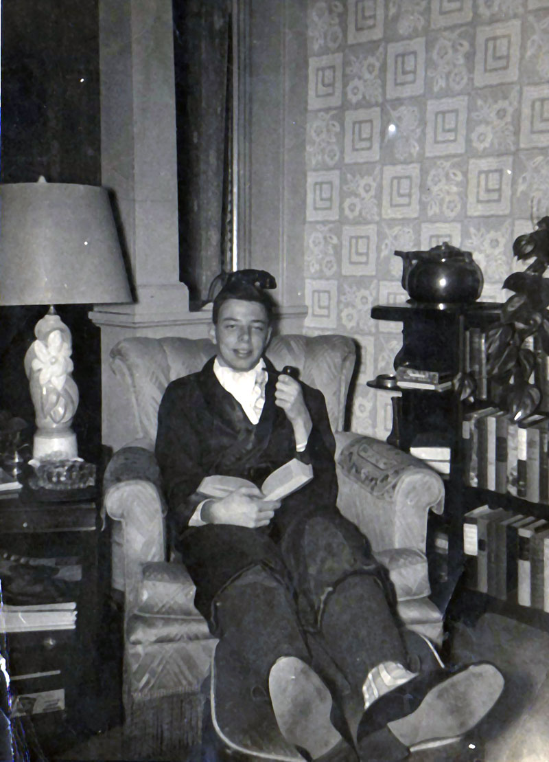 This is my dad at age 18, shortly before mustering out for the Army, circa 1951. This shot was taken in the family living room in Troy, NY. Dad's smoking a pipe (probably my grandfather's) and is wearing an ascot, a robe, striped silk socks, and is surrounded by the 'finest' literature at that time - Reader's Digest condensed editions (again, my grandfather's). Just for the record, my family was not wealthy, but was in the apparel business - so everyone was well-dressed and well-shod, if nothing else.

It's weird for me to look at this photo, and think of my Dad presently, still sitting in an easy chair, at age 76, still reading books, still wearing his robe. View full size.