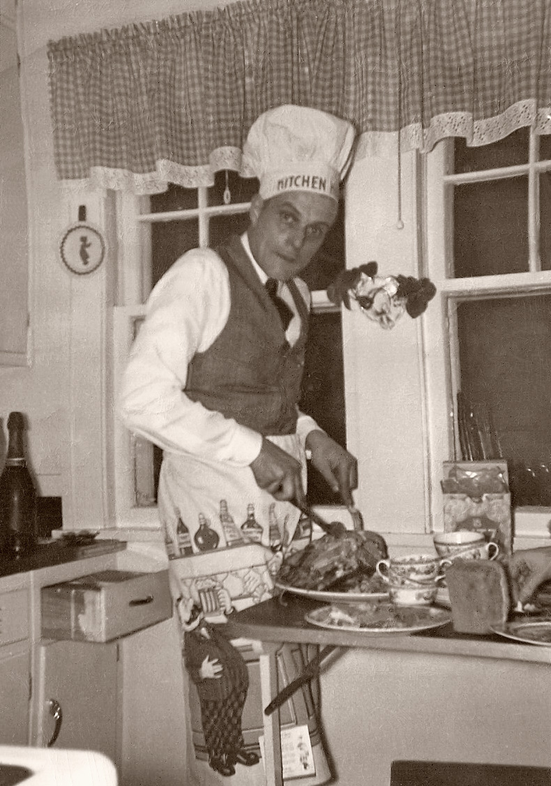 Dad in our extremely small kitchen on 7th Ave. in Rockford Illinois. The table folded out from the wall. He always carved. I'm guessing this was taken in the early 50's; I don't remember the apron. View full size.
