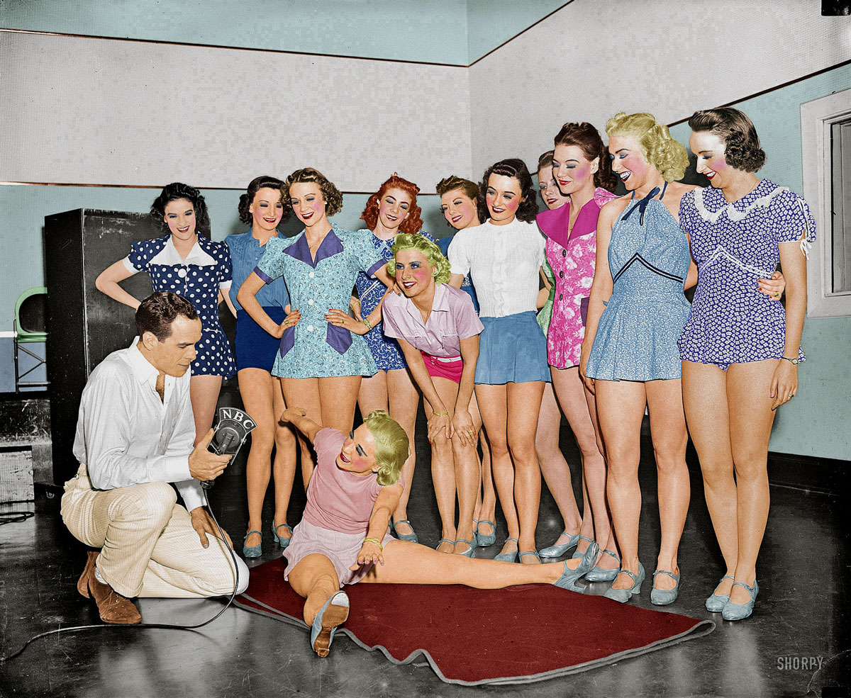 I just couldn't resist this one. I've always wanted to walk into a room full of women and brighten up their faces. It doesn't happen in real life so I thought I'd do it with this photo of dancers on the radio that I found on Shorpy. View full size.
