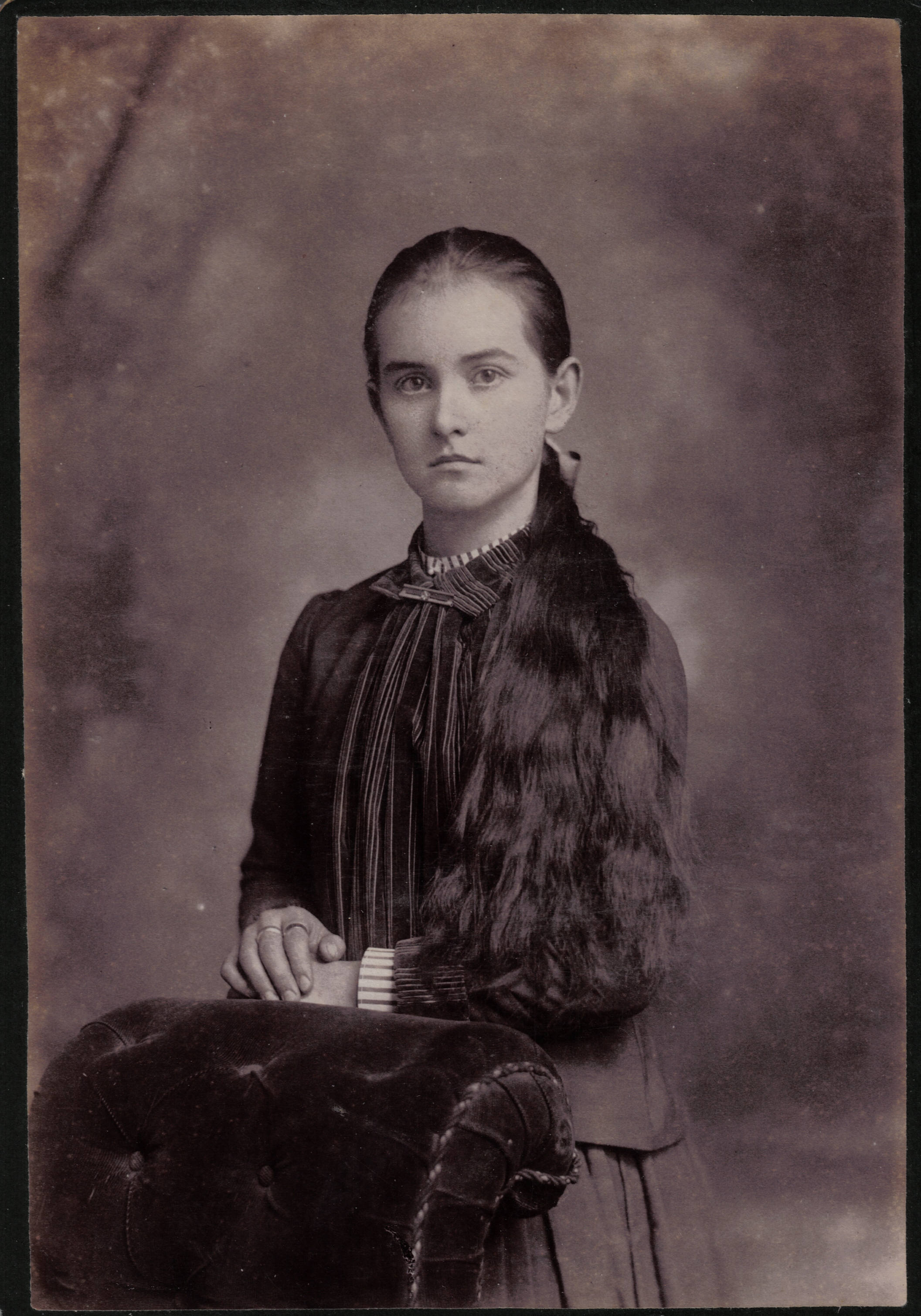 Would like to send May back to family. Her portrait is from the photo albums of Edward Milton Peters, who lived in Rushville, Missouri, for many years and spent the remainder of his life in St. Joseph. He died in 1941. Photographer J.W.Souder, St Joseph.