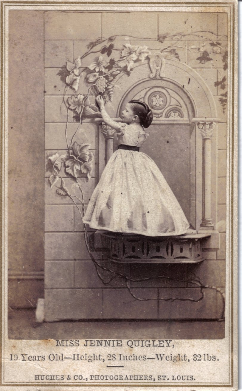 Miss Jennie Quigley, 19 years old. Height 28 inches; weight 32 lbs. Photographer Hughes & Co., St. Louis.