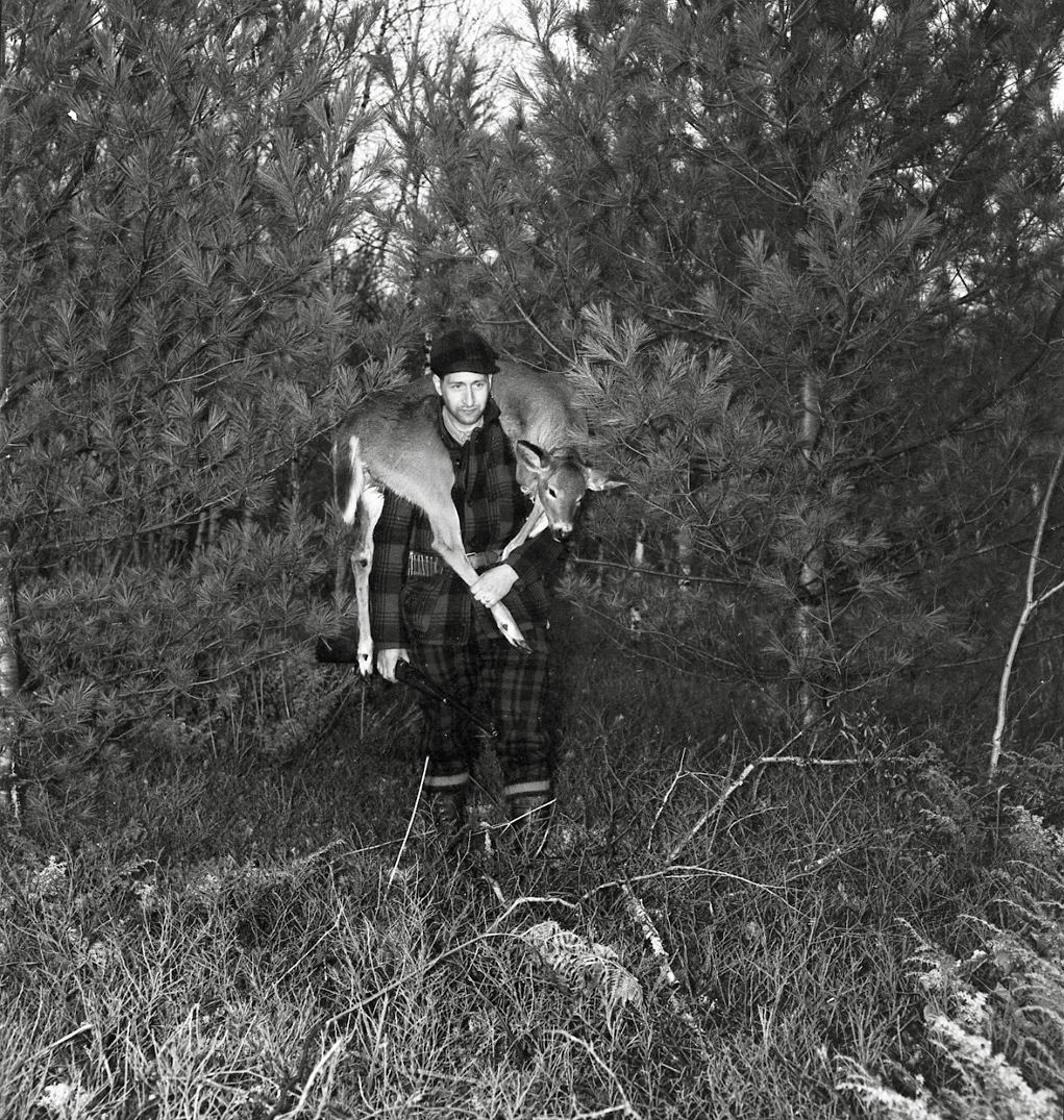 From the hunting cabin series. This is a successful deer hunter. Hopefully he didn't have to travel too far with this one. From my negatives collection. View full size.