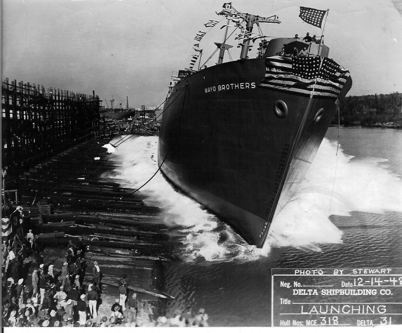 I don't know too much about the picture except what is on the picture and information from the internet. This is one of my father, Charles Tedesco's pictures. 
Delta Shipbuilding Company Launching December 14, 1942
New Orleans, Louisiana.
Ship Name - SS Mayo Brothers
Namesake - Charles and William Mayo
MC Hull No. - 318
Ship Type - Standard
Laid Down - October 28, 1942
Launched - December 14, 1942
Fate - Scrapped 1965
More information | View full size.
