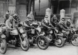 My father is the middle-most biker with the somewhat ill-fitting sunglasses, and the photo was taken in 1961 in Newcastle, NSW, Australia. Dad was seventeen at the time and had run away from home. He joined a traveling carnival, ended up working in a circus, then took up with a group of bikers. I think these were the Devil's Dozen. From memory, that leather jacket was stolen and it was the police that discovered this who sent him back on his way home to Bathurst, NSW. View full size.
Just amazingI love this photo. Could this be the tryouts for the cast of "Australian Graffiti"?
Grease is the wordDid your dad continue to live an adventurous life, or did he settle down?
[One three-letter word here makes this what I call a self-answering question. - Dave]
(ShorpyBlog, Member Gallery, Cars, Trucks, Buses)