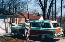 Great aunt Kirsti with her wheels at my grandparents place at 830 Kings Highway, Lincoln Park, Michigan in the very early 1960's. View full size.
Tell her to keep that car1956 Ford Country Squire wagon. The smaller bit of wraparound chrome (actually the front parking light/turn signal assembly) above the bumper distinguishes this from the 55s. Not real wood, of course, but still cool, and along with Aunt Kirsti's garb makes this photo scream 1950s at the top of its lungs. Great shot, thanks!
Where is she from?Has she or her parents been born in Finland? Just asking because Kirsti is very common name here in Finland especially among elderly women.
Choice of ColorI imagine that someone bought this car because it was the model they wanted, but the only color the dealer had in stock.
Kirsti&#039;s Kar KolorMr Mel may be correct in his speculation, but as an evocation of 1950s color design, this could be right out of a Douglas Sirk Technicolor soapfest.
Seafoam Greentterrace is right on the money. The 1958 house that I grew up in had both a kitchen and a bathroom in similar aqua-turquoise hues.
US of AWe don't need no stinkin' electric cars!
Back to the futureI'm always intrigued by how these old cars look like they're still from some distant, advanced future, especially compared to today's lackluster car designs.
Great Aunt Kirsti rocks!I covet her car and every single thing she's wearing.  And the neighborhood.
(ShorpyBlog, Member Gallery, Cars, Trucks, Buses)