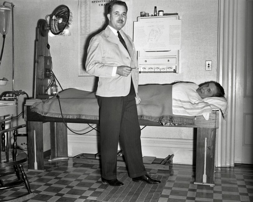 Honestly I am not sure what is going on here. There is something called a Spinotherapy Chart, whatever that means. The man doesn't quite look like a doctor. Any guesses? From my negatives collection. View full size.
