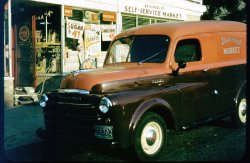 This is my grandfather's 1949 Dodge B-1-B panel truck, taken in front of his grocery store on School Street in Norwich, Conn. This picture dates from about 1949 or 1950. View full size.
Dad&#039;s groceryMore or less around this time, the 3-5 year-old me was wandering around my father's grocery store in San Francisco, gleeful that I could just pull anything off the shelf, take it to the back room and eat it. At this point a hazy but wonderful memory. How about you? Love the truck. My father's store, unfortunately, exists only in black-and-white.
That stroller...left without a concern for theft, is just like one I was pictured in. Thanks for reminding me of that ancient device.
Colorize ItHey tterrace, get the colorizers to colorize your father's grocery store.  
Don't bemoan the exisence of only black-and-white shots.  What are you waiting for?
1952Judging from the Connecticut license plate:  This was a black on silver 1951 Commercial truck plate with a green 1952 tab.
(ShorpyBlog, Member Gallery, Stores & Markets)
