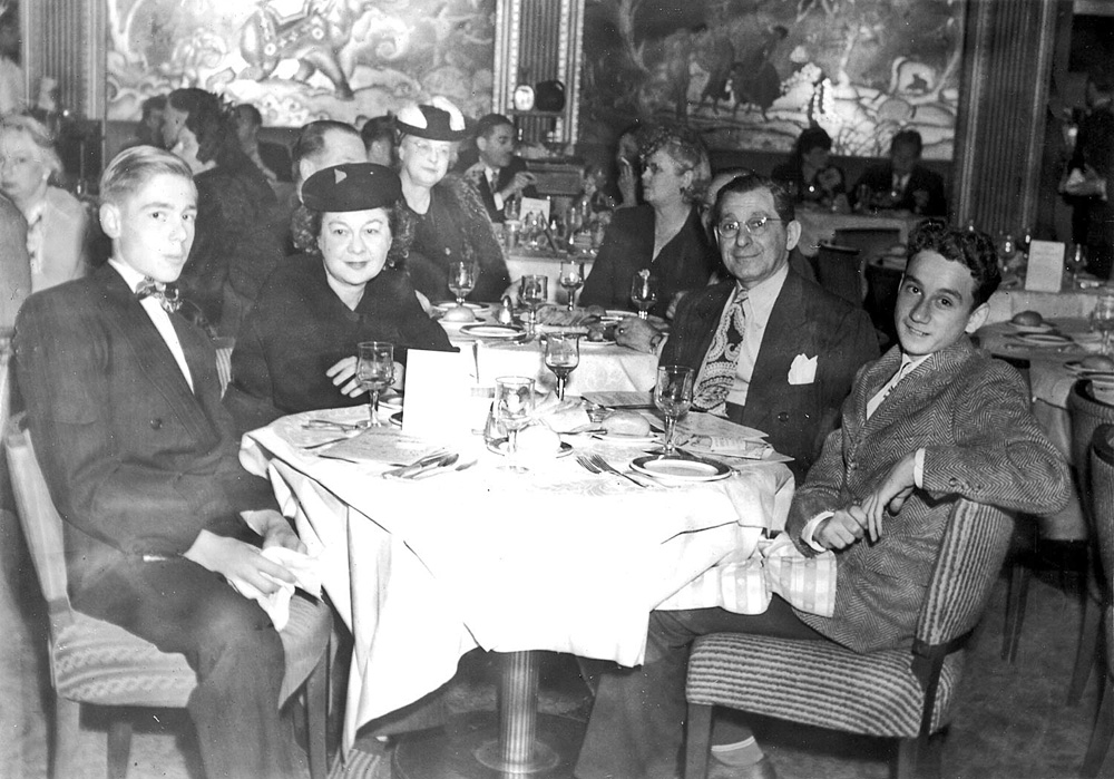 Persian Room, Hotel Sir Francis Drake, San Francisco,  June 18th 1944, Table 6. I know all this because this is a souvenir photo taken at the Drake, the date and place is on the folder it came in. Looks like Mom & Dad out with the kids (they don't look like brothers to me), perhaps a big night out before one or both of them shipped out to for the War? View full size.
