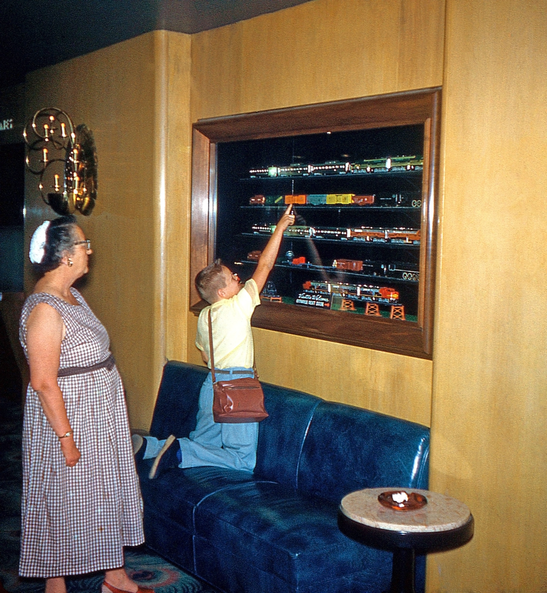 This is the mother and son from the Kodachrome Kitchen,This was taken inside their Hotel, probably in Chicago. Based on the comments written on this and other slides I know they took a train trip from Los Angeles to Chicago. This is one side of a Kodachrome stereo pair. View full size.