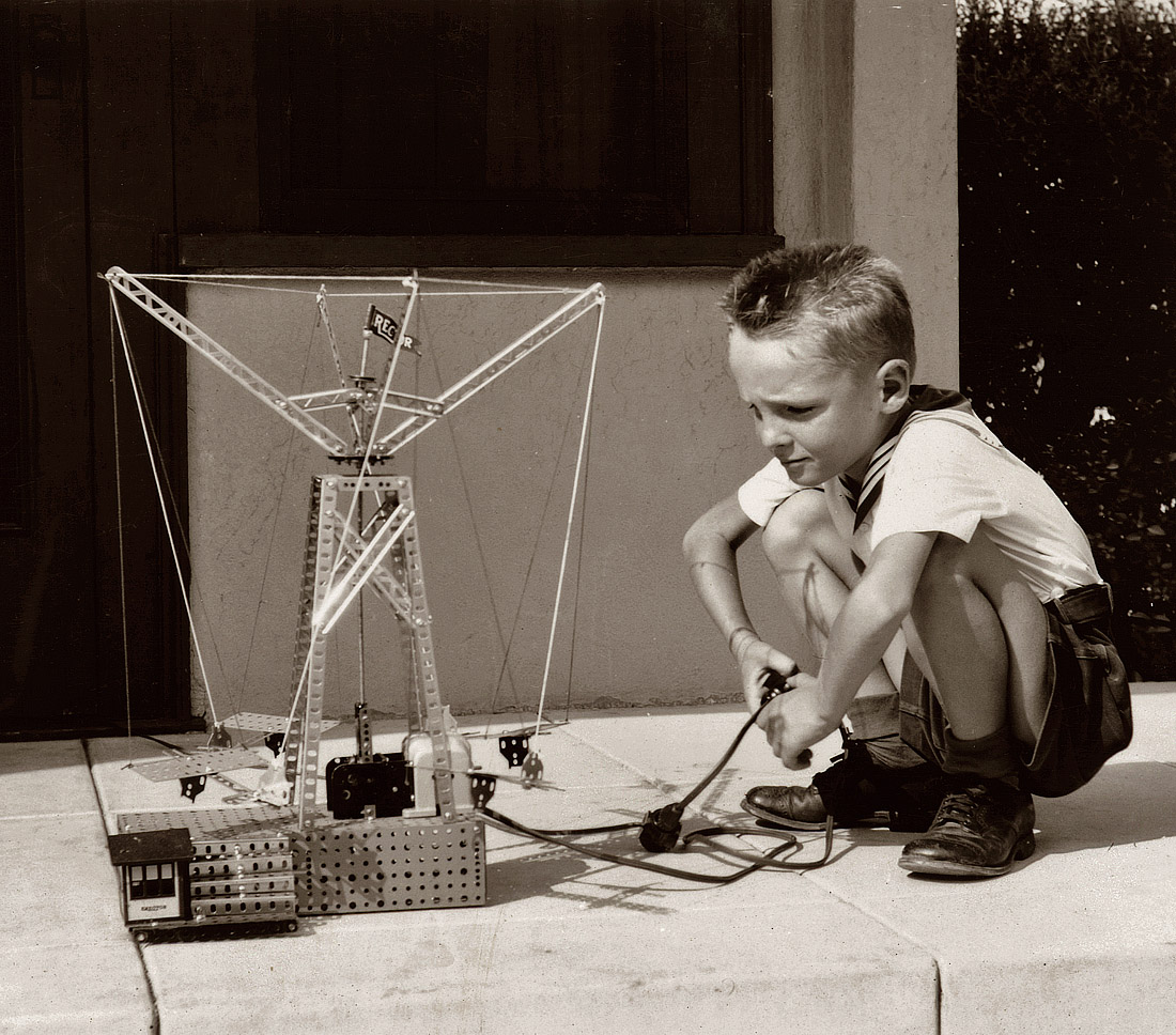 "Fall 1939." Little boy with what looks like a motorized Erector set.  Another snapshot I found on eBay. View full size. Where are you now, kid?
