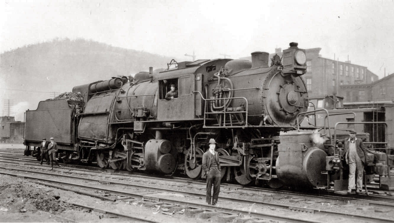 Erie 0-8-8-0 Camelback locomotive at Port Jervis, N.Y., in 1911. The camelback design was unique in that the engineer sat in the tiny cab alongside the boiler, while the fireman worked at the usual spot behind the boiler. One of the main disadvantages was the obvious communication problem between engineer and the rest of the train crew while the engine was in operation. The Erie camelback mallets didn't last long, but smaller camelback locomotives survived well into the 1950's on roads like the Jersey Central. View full size.