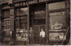 F.A. Cooke Drugs in Chicago, early 1900s. The image has a rare wooden candy vendor mounted to the exterior wall. One of my coin-op reference books shows a similar machine called a "Combination Vendor" from Ryede Specialty Works, c. 1910. View full size.
(ShorpyBlog, Member Gallery)