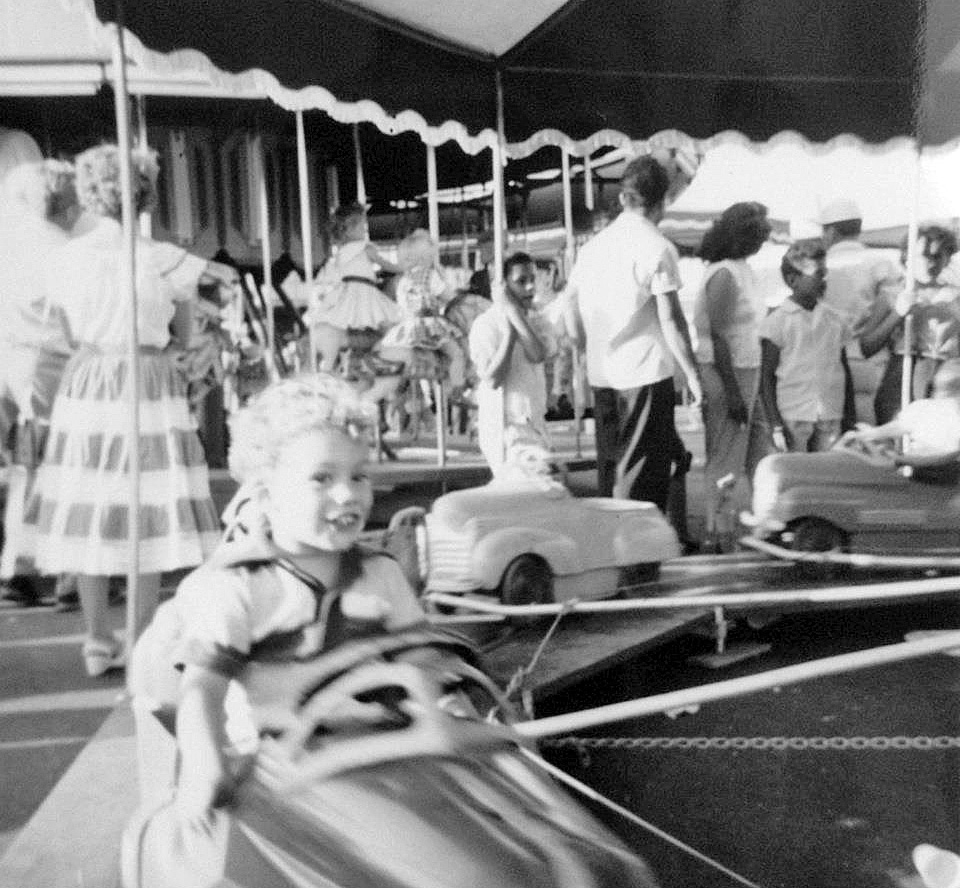 It is getting close to that time of year again. The Los Angeles County Fair in Pomona has been a destination for the area residences since 1922. Greg Herbert's brother Rod is enjoying the ride in 1955. Taken by Mary Herbert. View full size.