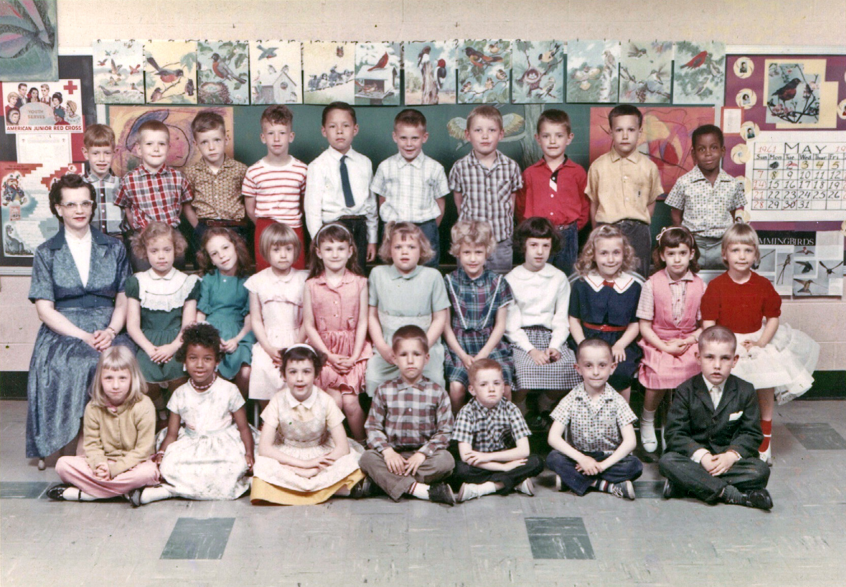 As long as we are sharing school photos, this was my first grade class at James Buchanan Elementary in Levittown, Pennsylvania. Our teacher was. Mrs Alice Stutzman. The date is May 1961 but that is not our classroom. We were in room 5. They set the chairs and camera up in room 1 and every class took their turn going there and posing. I am the girl in green with my head tilted. View full size.