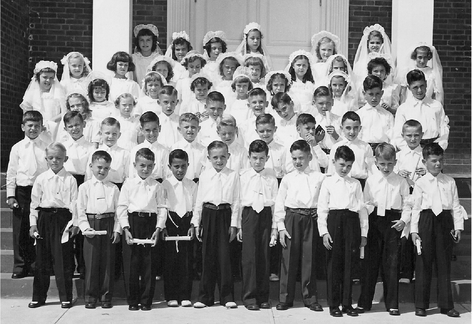 First Holy Communion - 1948 - St. Maurice Church, New Britain, Connecticut. Photo taken by my Father - that's me, fourth from left, second row. Kids in photo were all 7/8 years old. View full size.