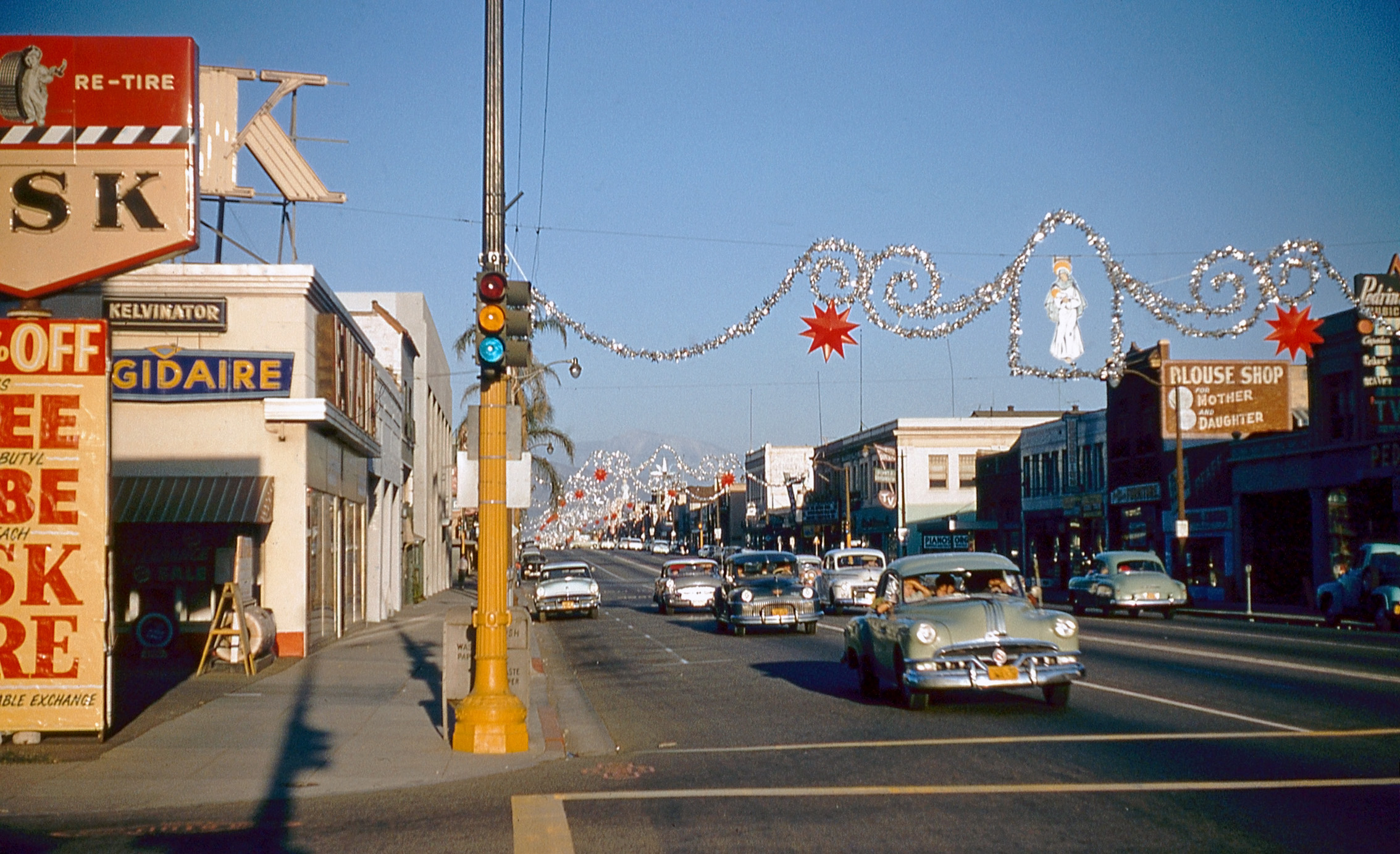 &nbsp; &nbsp; &nbsp; &nbsp; Location Update: We are on West Main Street in Alhambra.
A found Kodachrome slide of a Southern California street scene, possibly Alhambra or Pasadena, going by the address labels on other boxes in this collection. "1956" is written on the box cover. View full size.