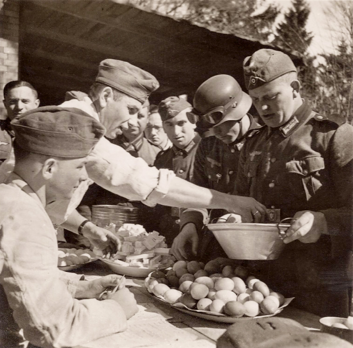 German soldiers in a chow line, only 3 eggs per man. All the cheese you want. View full size.