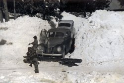 Unknown date or location of this picture, likely late 1940's and taken either in the Sierra Nevada mountains or near Salt Lake City. I know the Ford is a pre-war model. View full size.