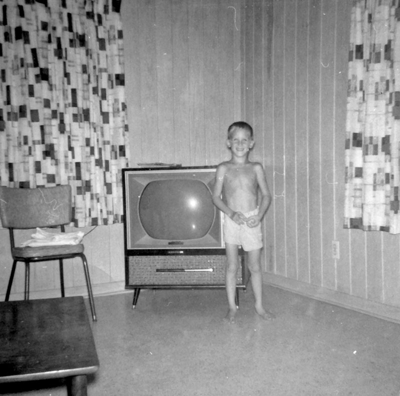 I was inspired by tterrace to submit this picture of me at our small home on Blythe Island, Georgia.  I spent many happy hours watching this black and white TV. View full size.