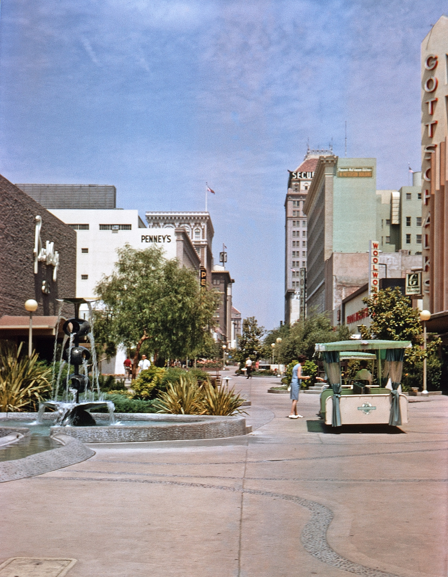 Our 1967 vacation first took us to Sequoia and Kings Canyon National Parks; then on the way to Yosemite we went through Fresno, where I took this Kodachrome slide of the Fulton Mall three years after its opening. Pedestrianizing Fulton Street, with designs by architect Victor Gruen and landscape architect Garrett Eckbo, was a major part of Fresno's urban renewal program of the 1960s. Ironically, now that the big chain stores seen in my slide are long gone, the city's plan to revitalize the area by re-introducing traffic onto Fulton Street is underway. View full size.