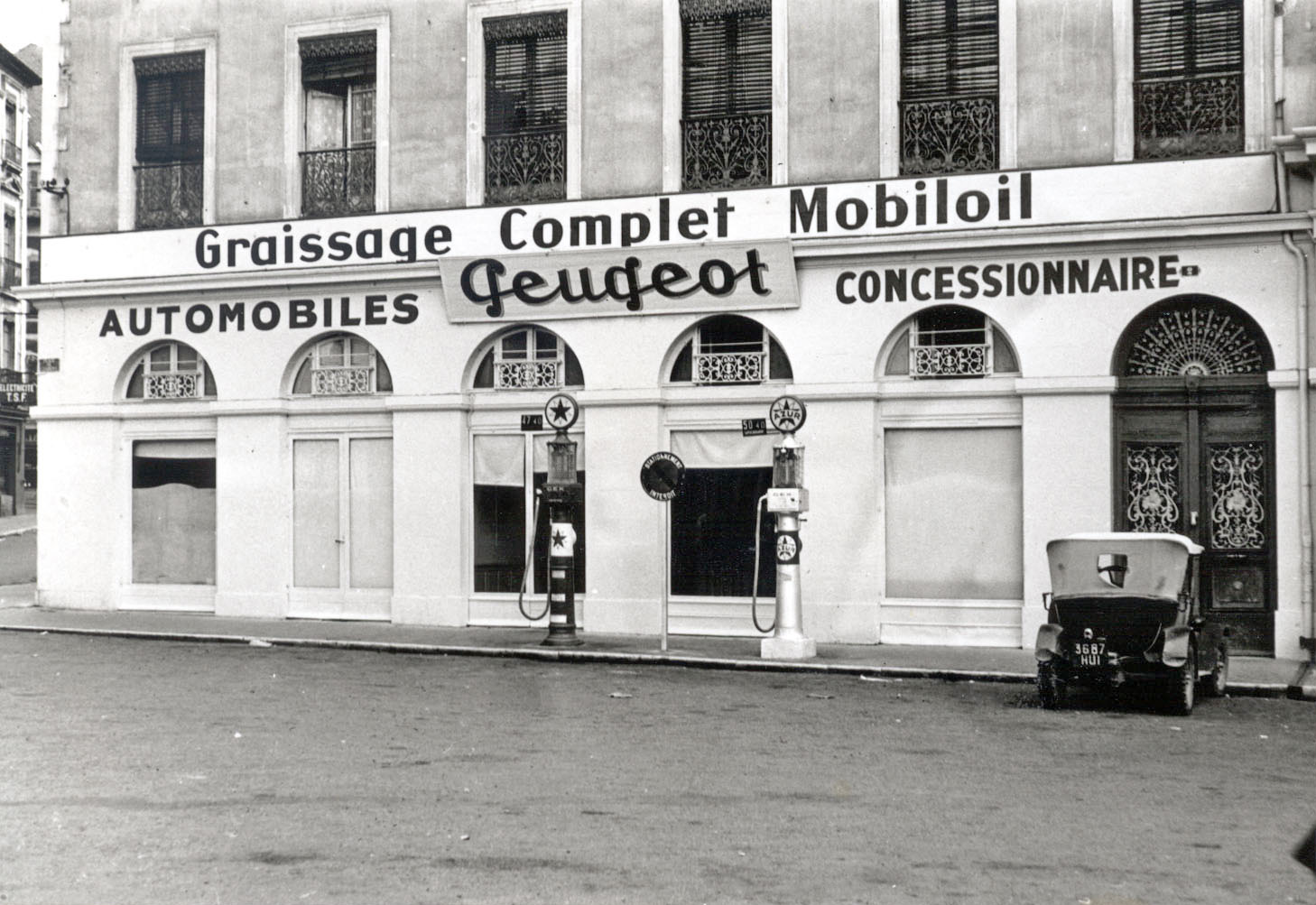 French Peugeot car dealer; no idea where ... circa 1925. View full size.