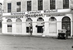 French Peugeot car dealer; no idea where ... circa 1925. View full size.
(ShorpyBlog, Member Gallery)