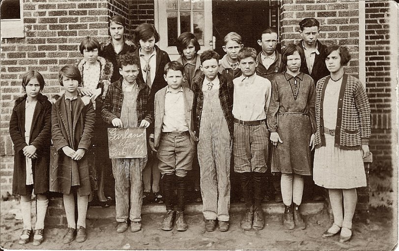 This is the 6th grade class at Garland School in eastern North Carolina in 1937. Note the two boys on the front row in matching striped overalls. Twins, maybe?
