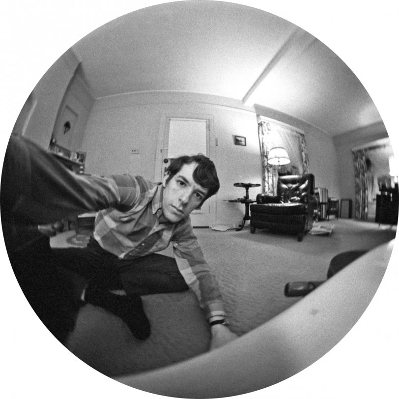 I'd seen 2001: A Space Odyssey only two years before, but staring into the eyeball of a sentient computer really wasn't on my mind when I took this shot in our living room; I was just fooling around with my newly-acquired Spiratone fisheye supplementary lens and some Tri-X film. Interesting optical phenomenon: the shape curving around the lower right is actually the edge of a small, perfectly round tabletop. In the background, Father's leather chair, minus Father, with piles of newspapers to each side. That little painting on the wall is now on my wall, and I now have an exact duplicate of the kidney-shaped tier table, thanks to my sister's antique foraging. My stereo system is in evidence by the speaker in the far corner, and my still-pitifully small record collection is on the rack behind Father's chair. I'm 23, still living at home, though employed and contributing to my upkeep. View full size.
