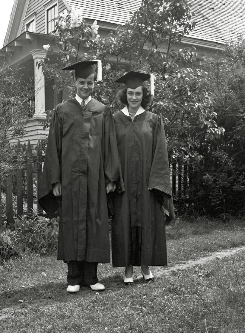 A young couple happy to be done with high school (just guessing). From my negatives collection. View full size.
