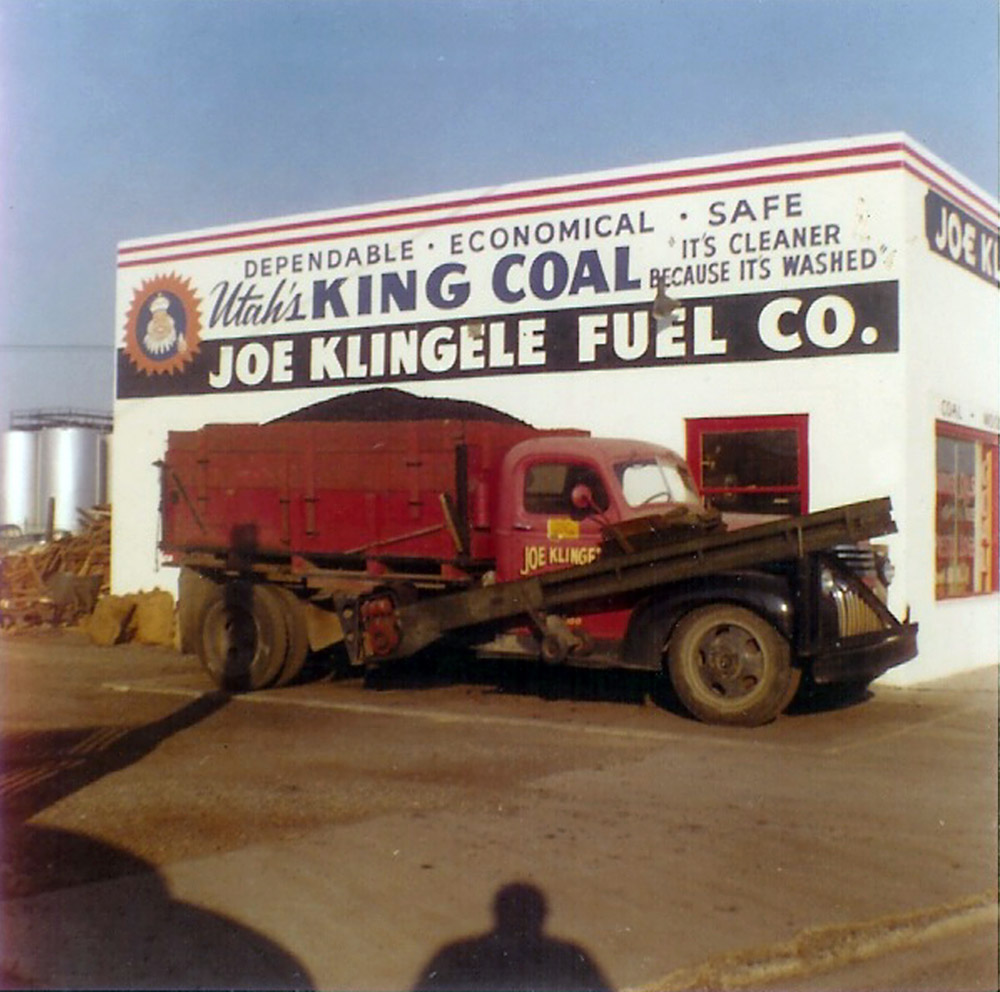 This was my grampa's  business in Yakima, Wash. He sold coal and wood for heating. He was in business until about 1968. On the side of the truck is the conveyor belt to unload coal into underground bins.  