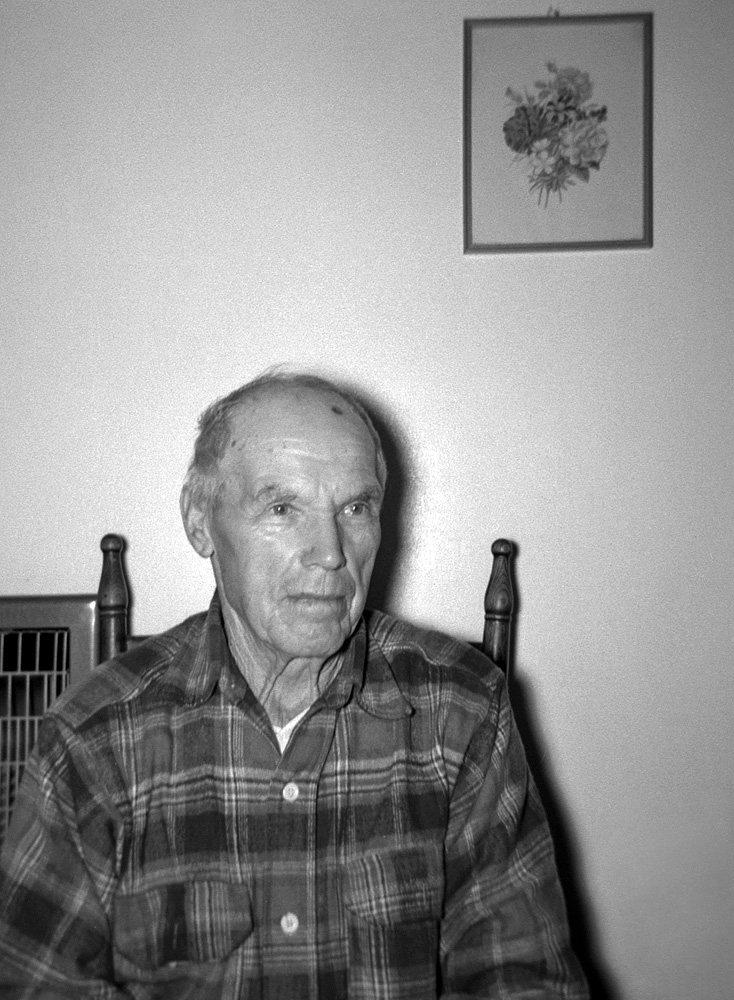 My paternal grandfather in his home in Calpella, California, in late December 1954. Born February 1874 in Murialdo, Italy; married a local girl in 1901. Arrived New York July 1904. After getting settled in Northern California, sent for my grandmother (age 24), father (age 4) and uncle (age 2) in 1906. Naturalized in 1914, then a year later purchased a ranch in Calpella, built a house, and grew wine grapes for nearly 40 years. A couple years before this was taken he sold the ranch and moved next door to this house. He died in August 1961, aged 87. He was always Grandpa to me, but his given name was Agostino. Photo by my brother or sister. View full size.