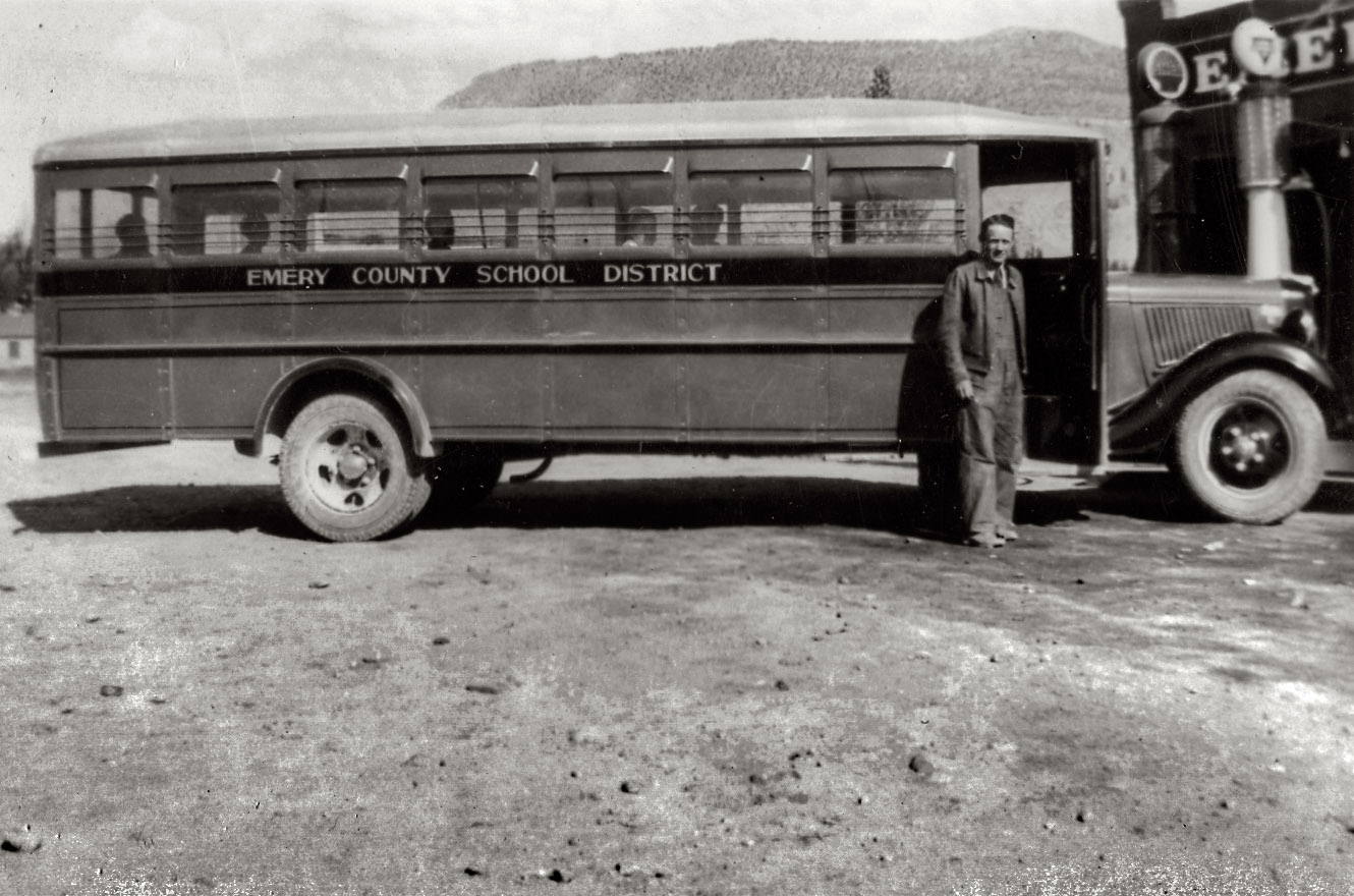 My wife's grandpa at Emery Garage. In addition to driving the school bus he also ran the projector at the local movie theater. 1930's or early 40's?