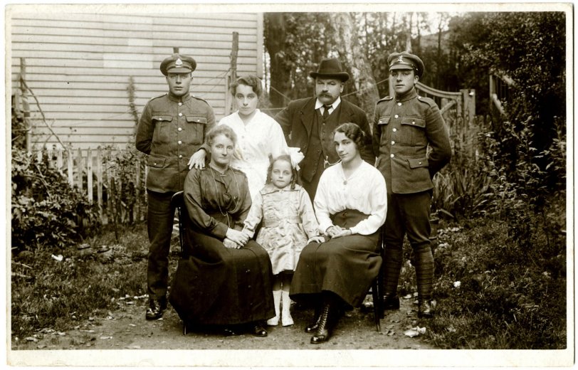An unknown English family portrait taken in the later half of the Great War. With both boys in the infantry (Suffolk Regiment and Queens Own Royal West Kents). View full size.
