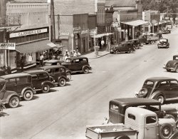 "County seat of Hale County, Alabama," in August 1936 as photographed by Walker Evans. View full size. The McCollum Grocery on the corner is the subject of another Evans photo, where it's identified as being in Moundville. See Bill Cary's comment. Is this Moundvlle? Haleyville? Greensboro? (Other Evans photos identify this store as being in Greensboro, the county seat.)