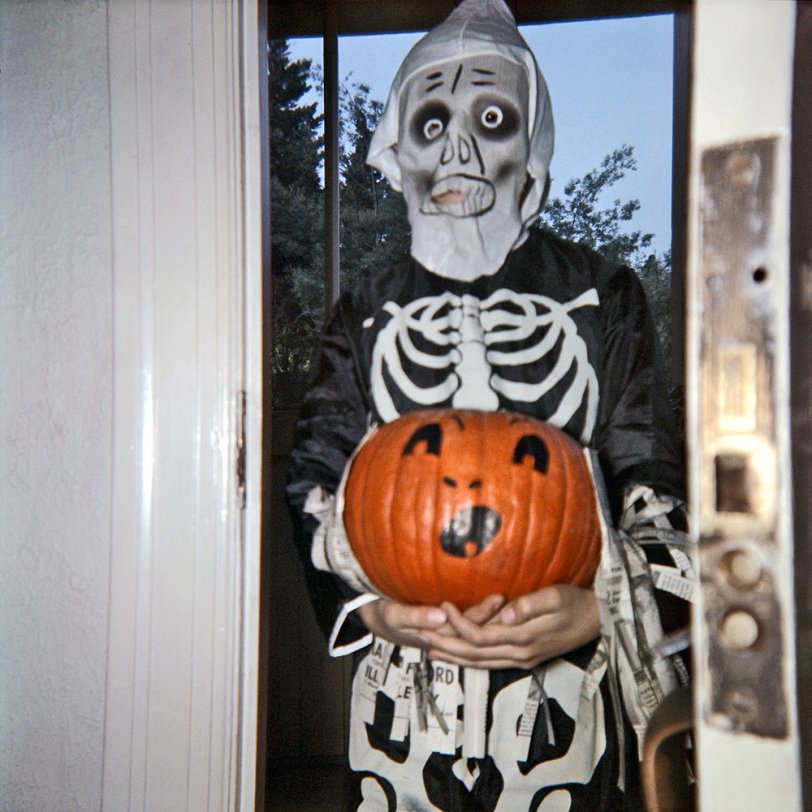 Halloween 1957, or "Tterrace and the Haunted Door Lock." Must be a dry run, since it's still daylight outside. My sister did the pumpkin decoration with an early felt-tip marker, and took this 2-1/4 square transparency. I'm 11. View full size.