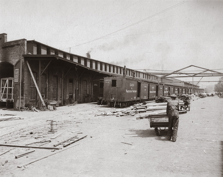 Haskell and Barker Car Company railroad car erecting shop, Michigan City, Indiana, featuring some fully erect products soon to be in service on the transportation behemoth Idaho and Washington Northern.  Later, Pullman-Standard owned this facility.  In lock-step with the shrinking of industrial potential in America, there is now an outlet mall on the site of the former shops.  See here for some interesting history of the plant. View full size.
