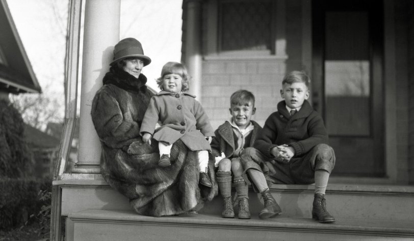 A mom and kids hanging out on the porch on a chilly fall afternoon. From my negatives collection. View full size.

