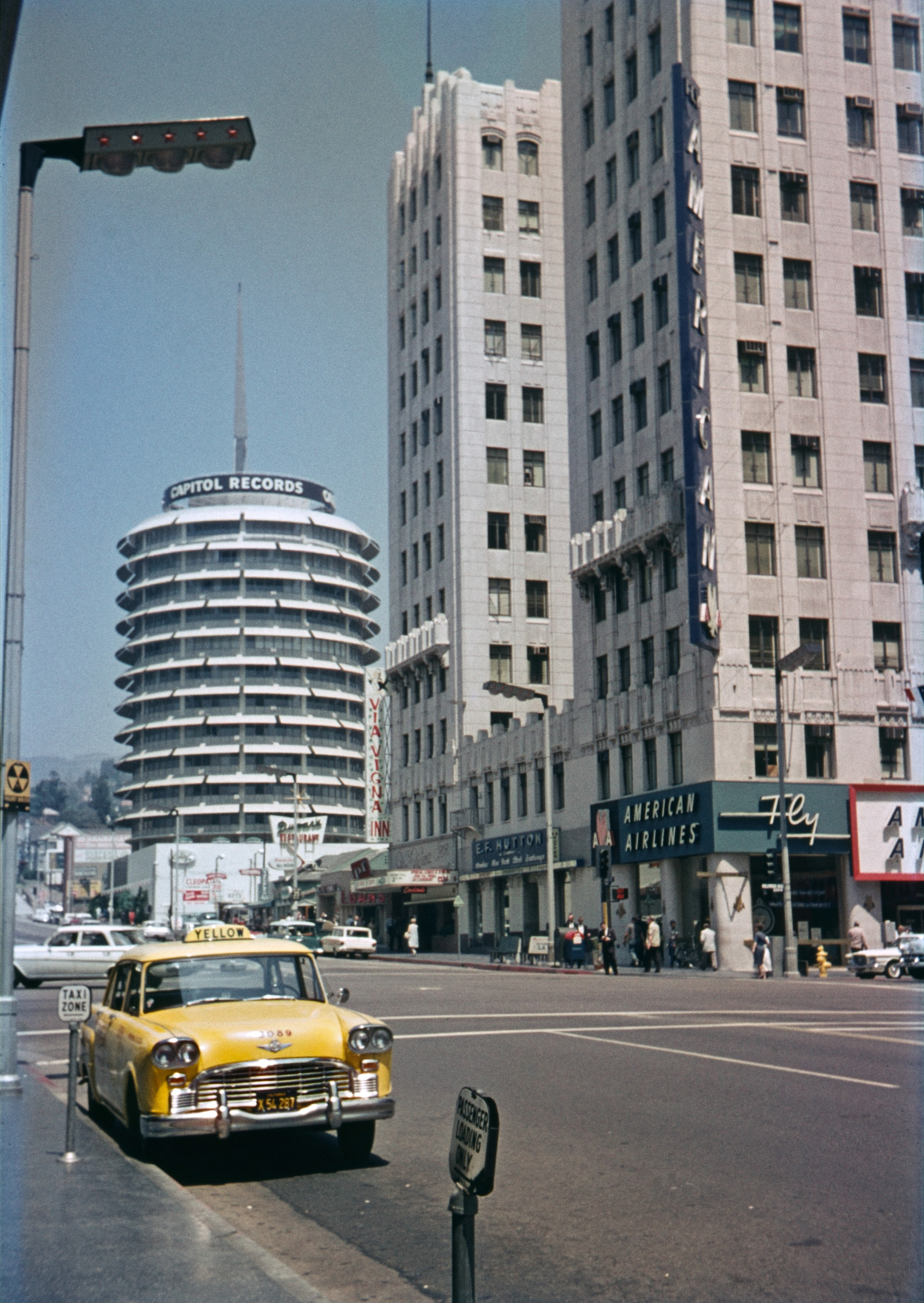 The historic Capitol Records Tower and Equitable Building dominate my slide from August 1963. But we're more interested in the Checker cab, the weird streetlight, the fallout shelter sign, the men in suits, the women in hats carrying purses and the Via Vigna Inn, aren't we? Less interesting: bizarre color issues courtesy Montgomery Ward-branded film. View full size.